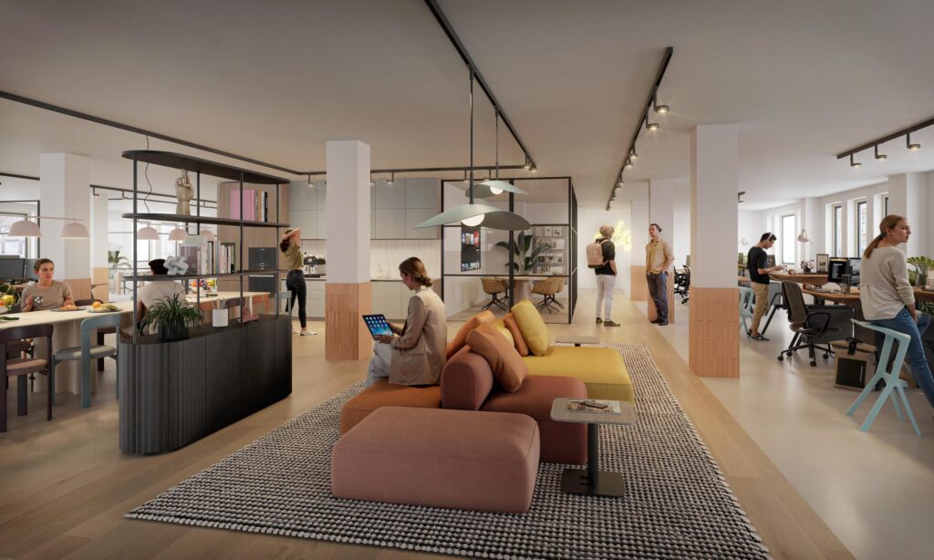 Modern open-plan office on Nieuwe Looiersstraat with people working, relaxing, and socializing in a stylishly furnished space.